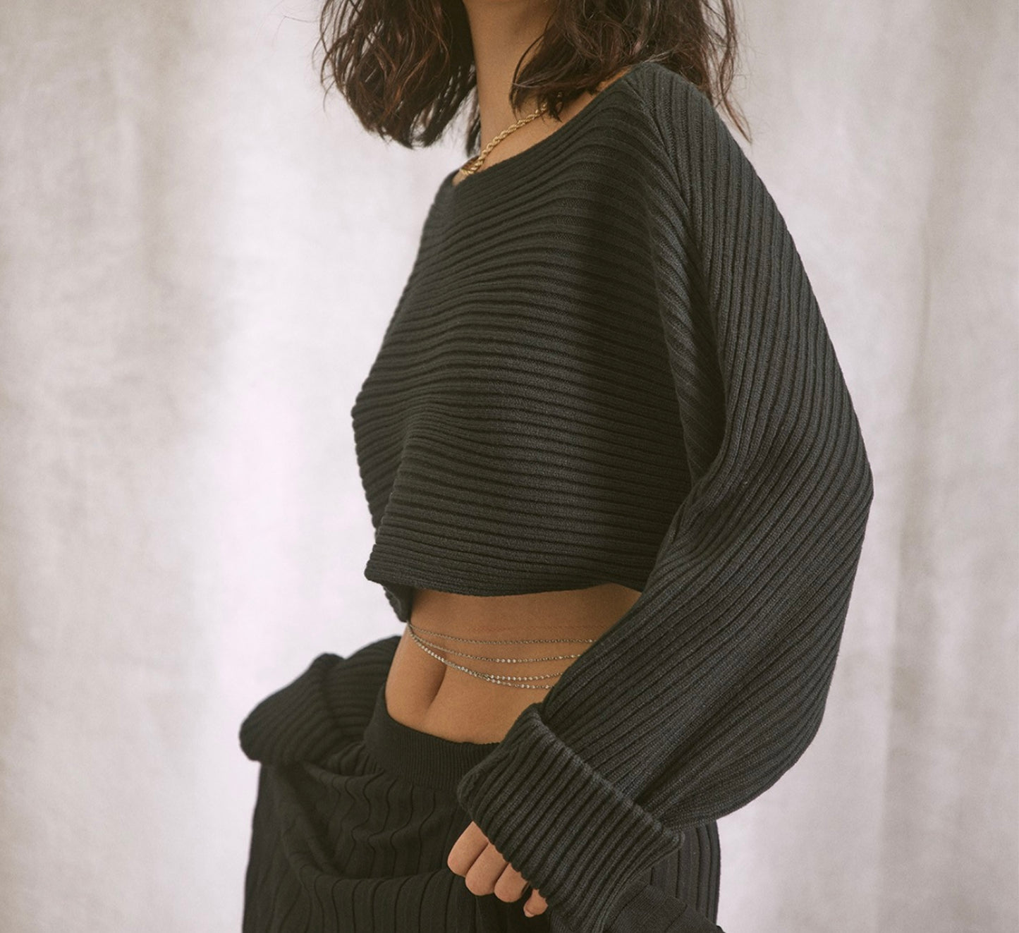 Black ribbed cropped sweater with boat neck