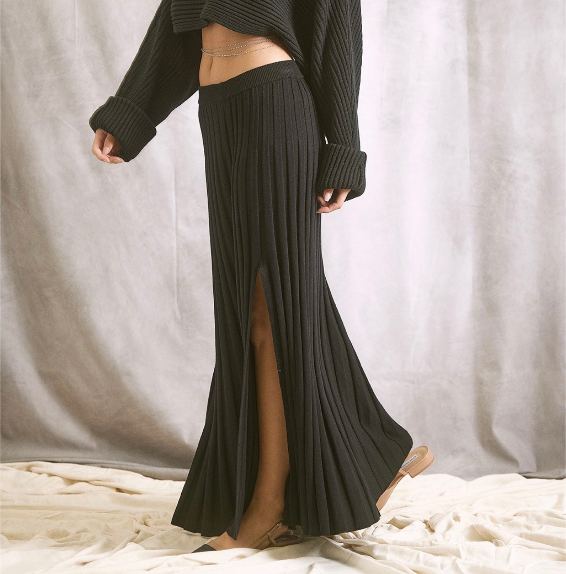 Black A line knit maxi skirt with ribbed detail with leg slit