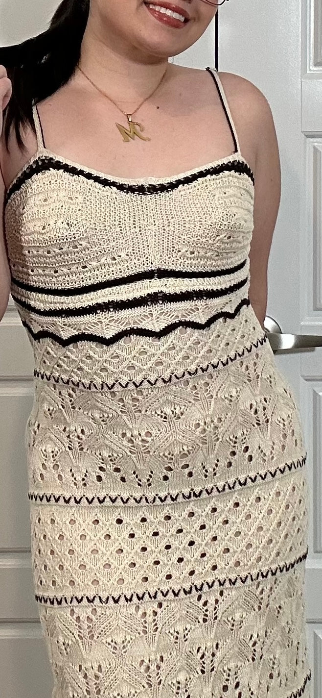 Cream crocheted dress with black stripes and woven details