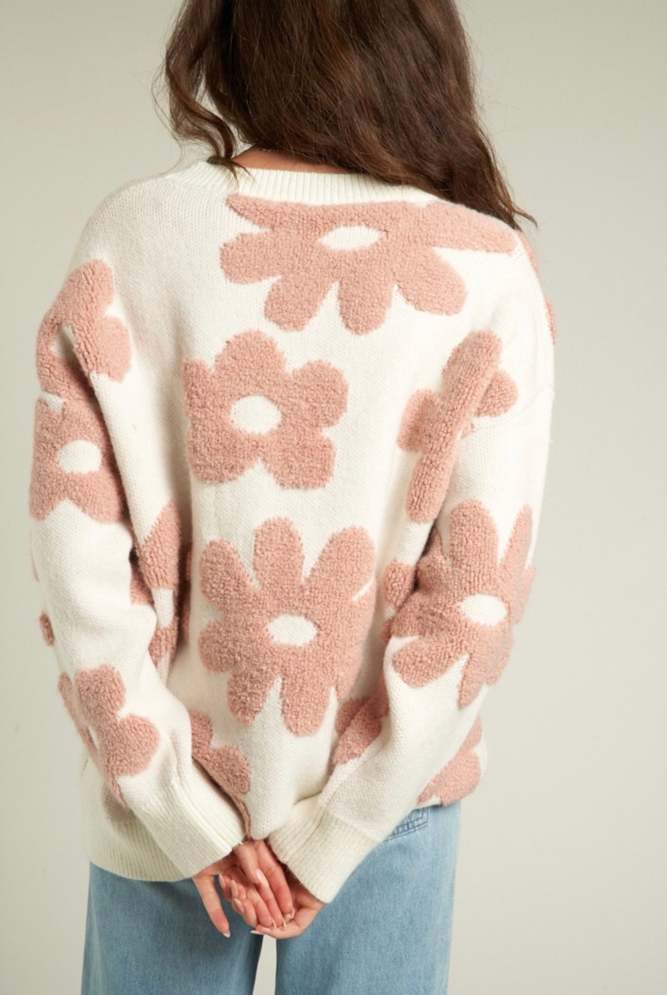 White sweater with large fuzzy mauve pink flowers 