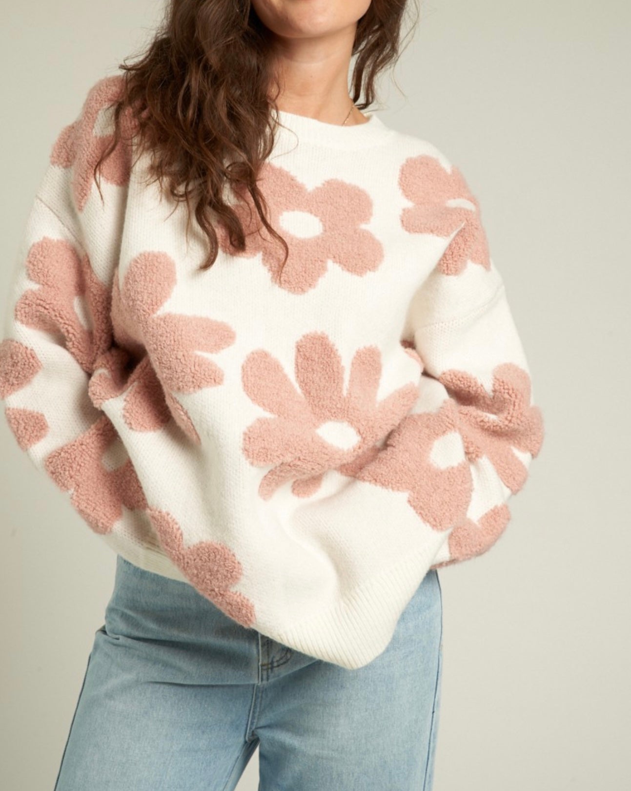 White sweater with large fuzzy pink flowers 