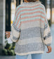 Oversized cream sweater with navy, gray, teal, and red stripes