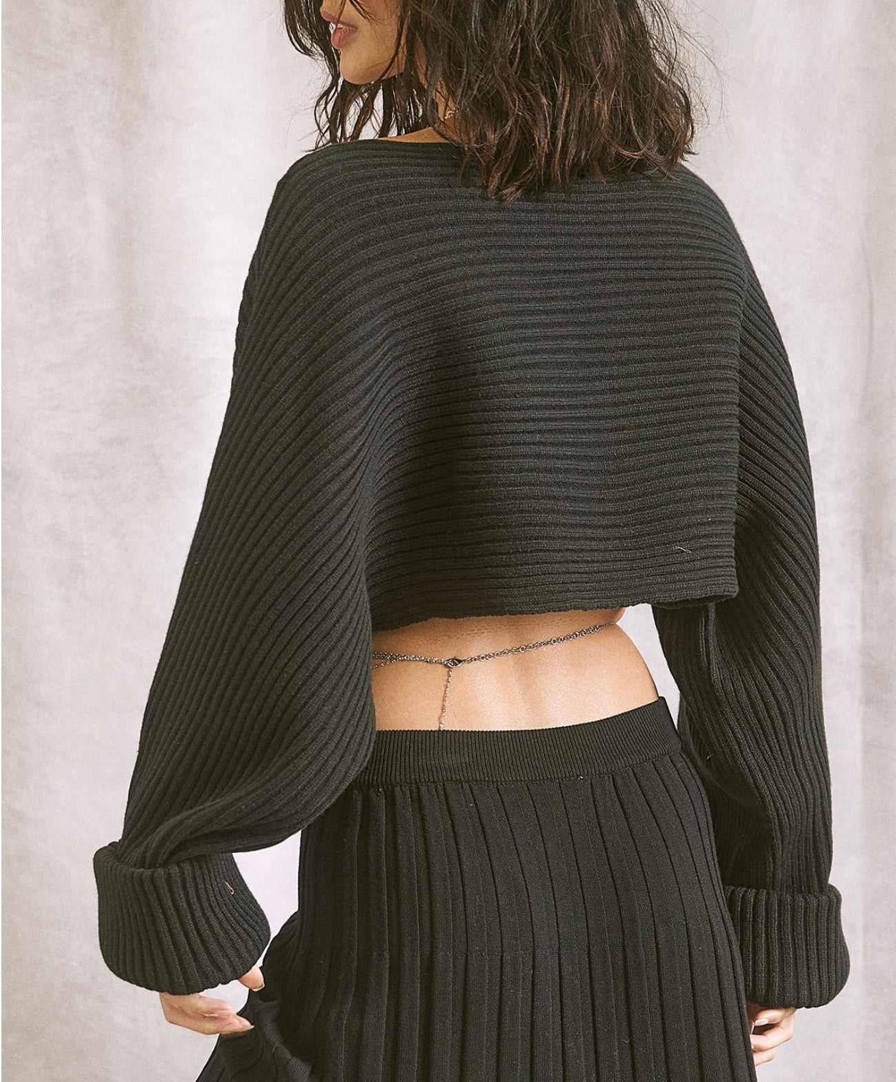 Black ribbed cropped sweater with boat neck