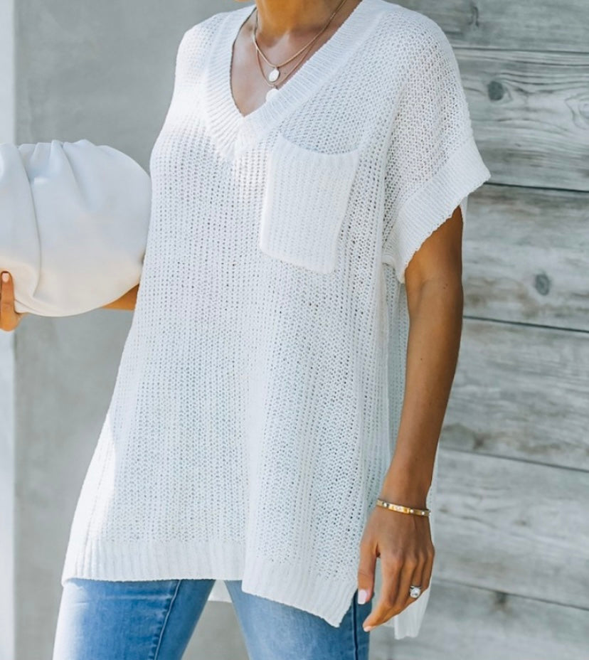 Lightweight white short sleeve sweater with chest pocket and slit detail on the side