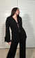 Black textured knit long sleeve cardigan with tie in the middle