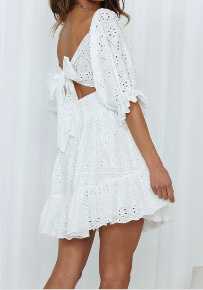 White floral dress with half length sleeves and tie in the back