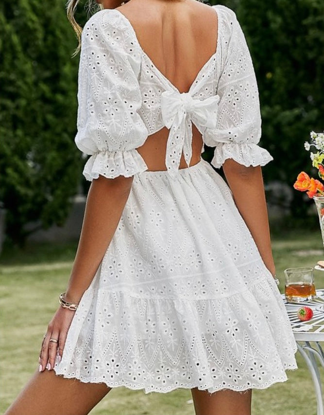 White floral dress with half length sleeves and tie in the back